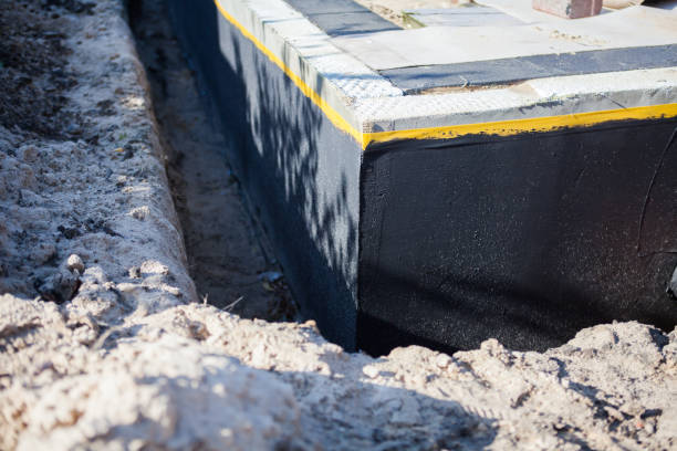 Professional Emergency Waterproofing technician working in Osgood, IN